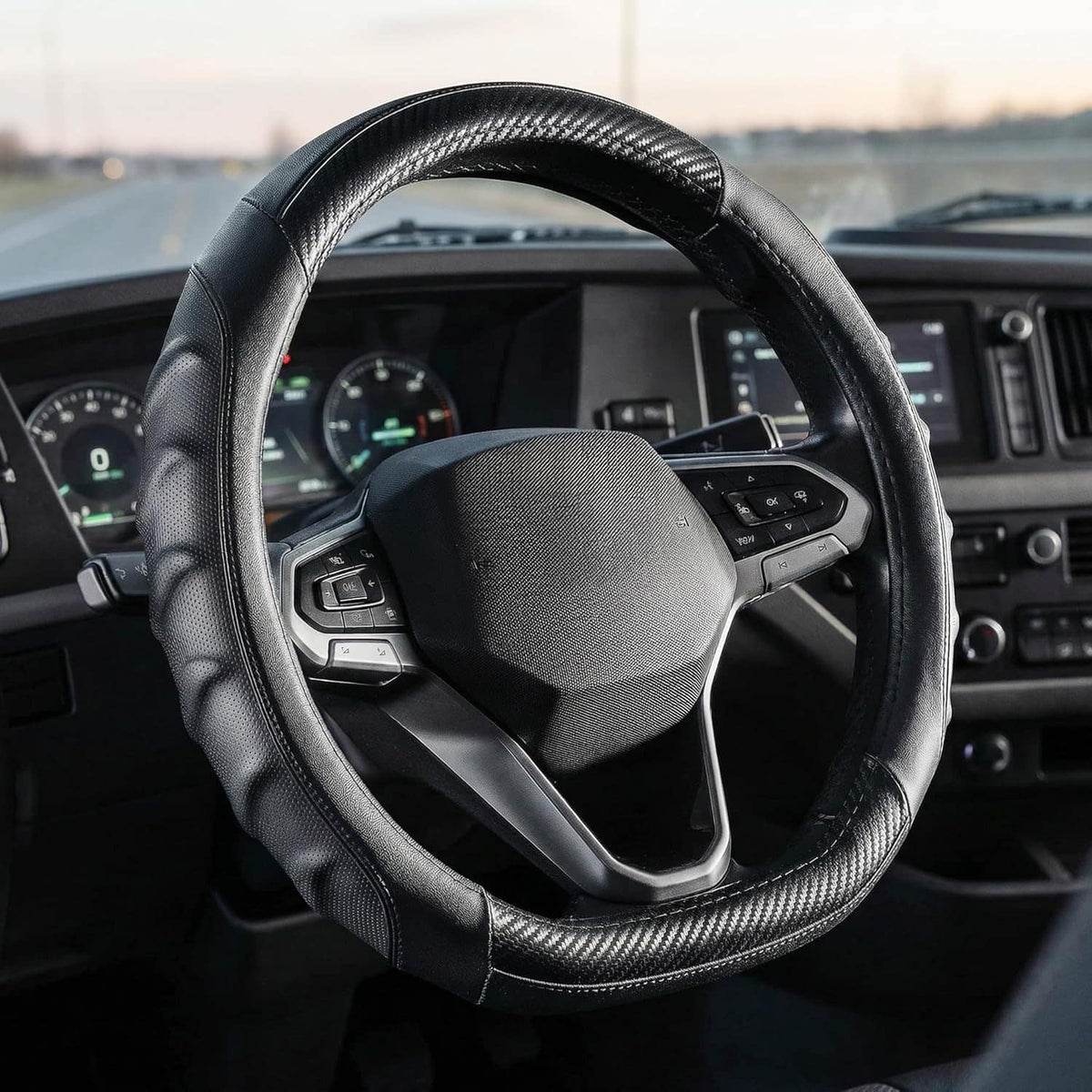 Vyonix 15 inch carbon fiber D-shape steering wheel cover installed on a car dashboard